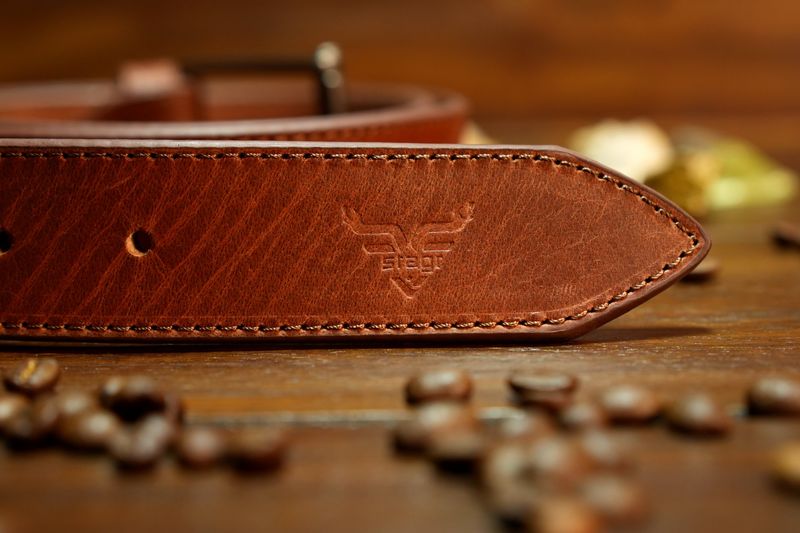 FIG. 01 · Graded hide, embossed strap tip